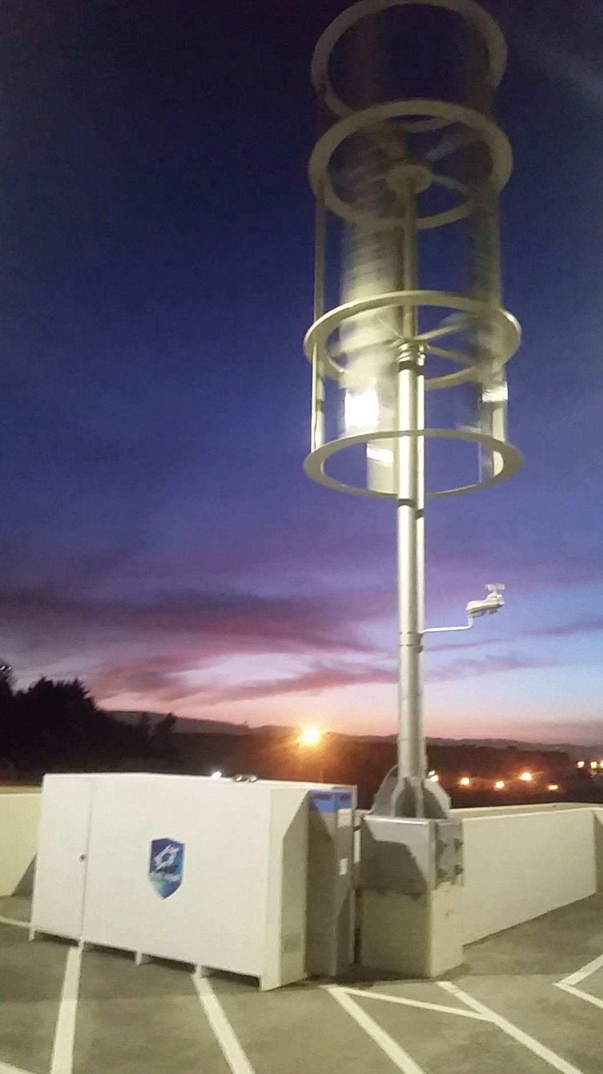Sylentra MAG-LEV turbine operational at dusk — control unit visible